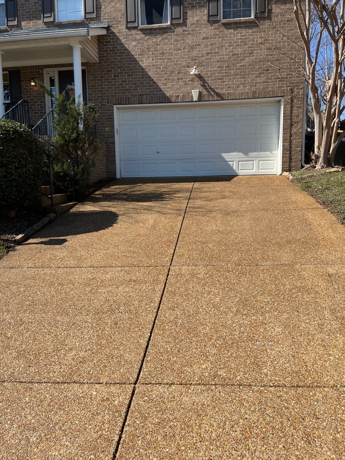 Aggregate driveway in Bellevue after full water-based natural sealer application — non-glossy finish